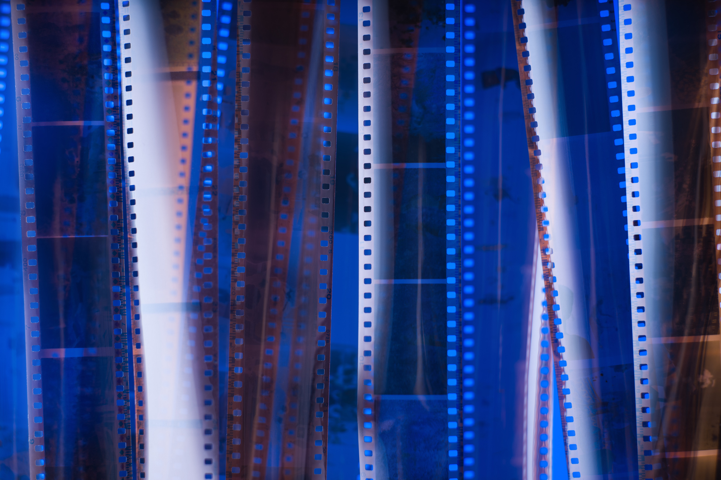 Analog photographic film texture. Blue lighting.
